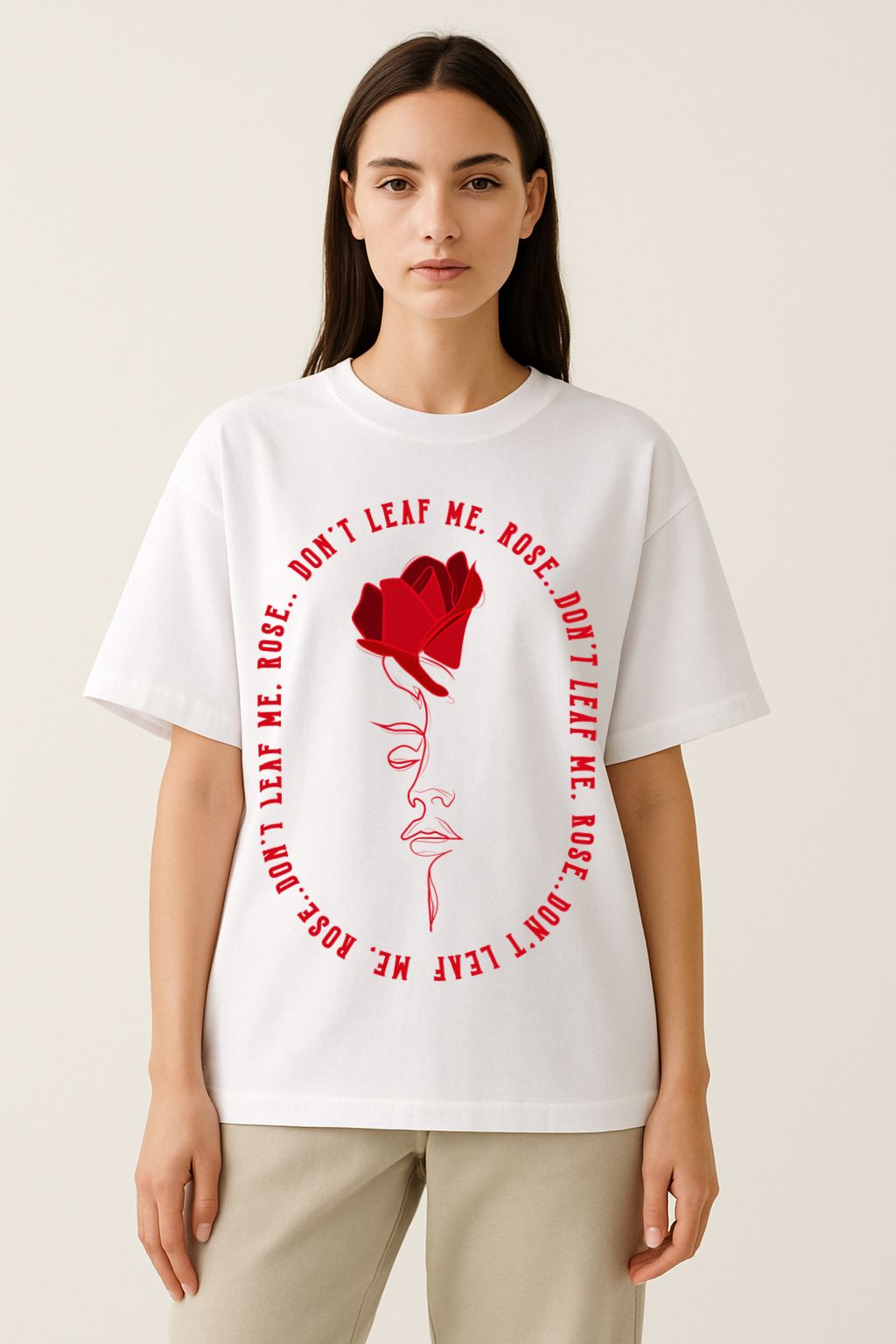 Female model wearing white oversized rose graphic tee with abstract face line art, unisex streetwear style