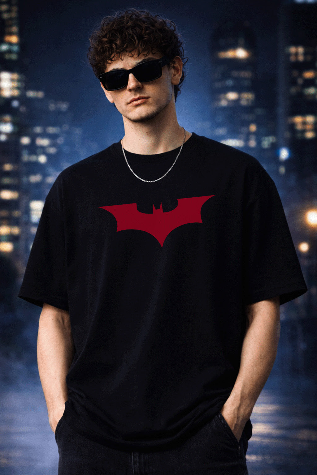 Person wearing a black t-shirt with a red bat symbol against a cityscape background