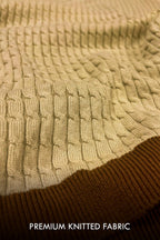 Close-up of a cream and brown premium knitted fabric with textured cable and ribbed patterns, with the text 'PREMIUM KNITTED FABRIC' at the bottom.