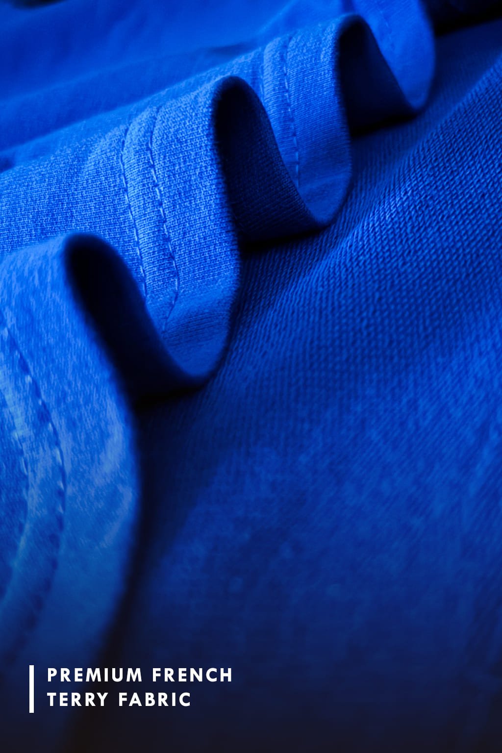 Close-up of blue fabric with 'Premium French Terry Fabric' texture
