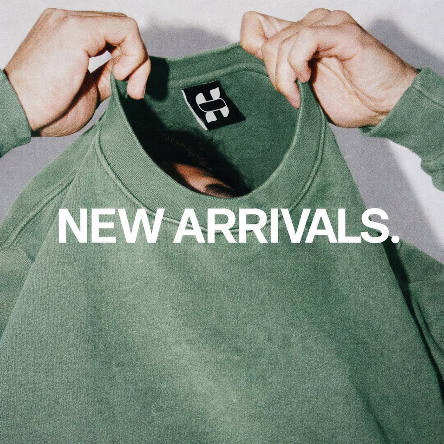 Green tshirt with a hypesight brand logo and 'NEW ARRIVALS' text on a plain background