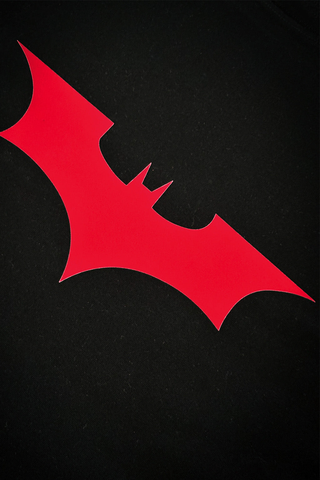Red bat symbol on a black background