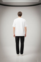 Back view of oversized white cotton t-shirt for men and women showing relaxed fit and minimal plain back design