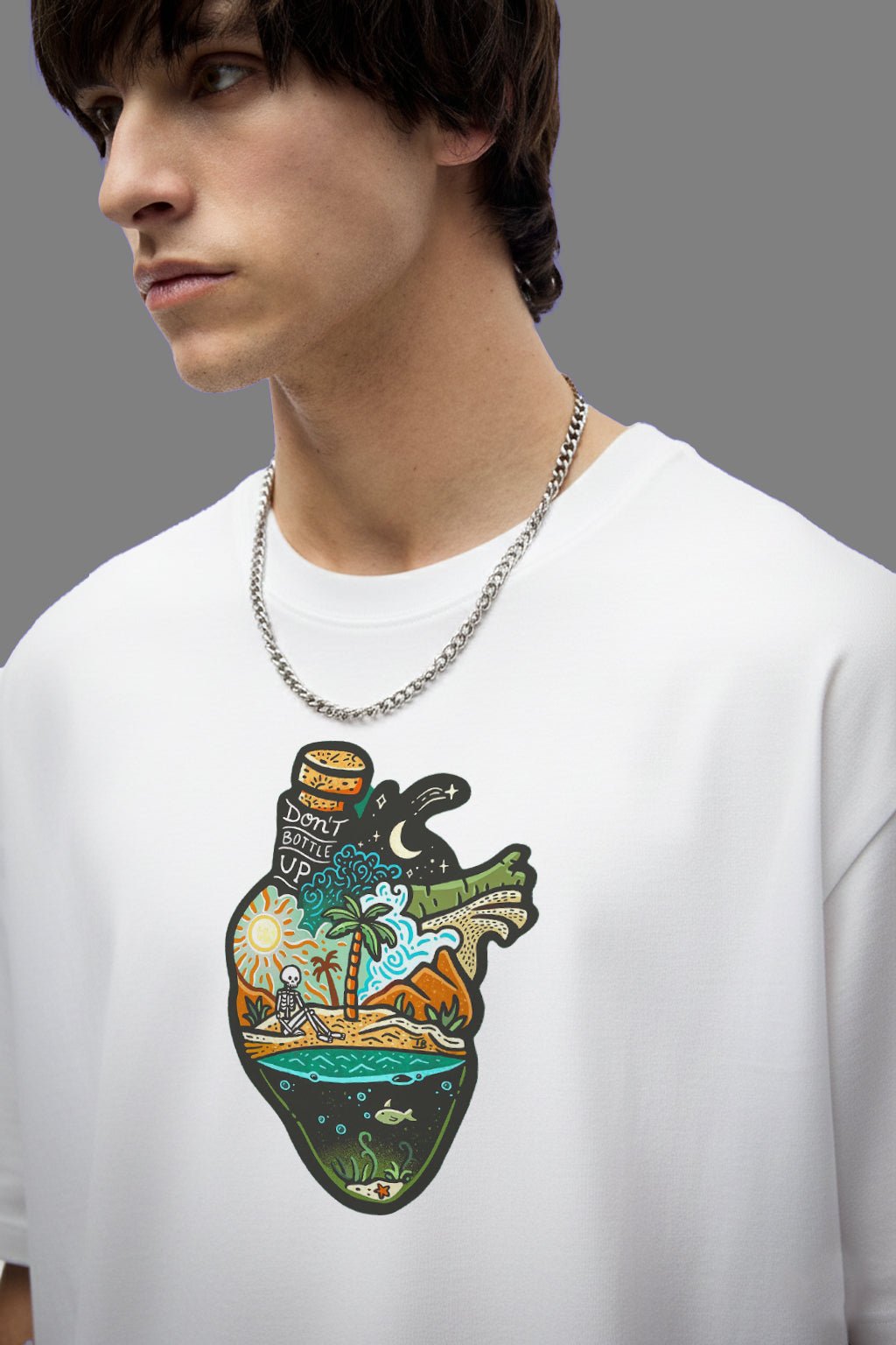 Beach inspired graphic printed t-shirt for men and women featuring artistic travel and ocean illustration on white cotton tee