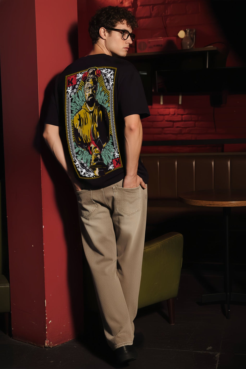 Angled back view of Breaking Bad Walter White graphic oversized black T-shirt with detailed king card illustration