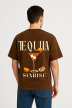 Back view of Brown Tequila Sunrise oversized cotton t-shirt featuring bold cocktail glass graphic with sunrise design