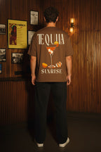 Back view of Brown Tequila Sunrise oversized cotton t-shirt featuring bold cocktail glass graphic with sunrise-inspired design
