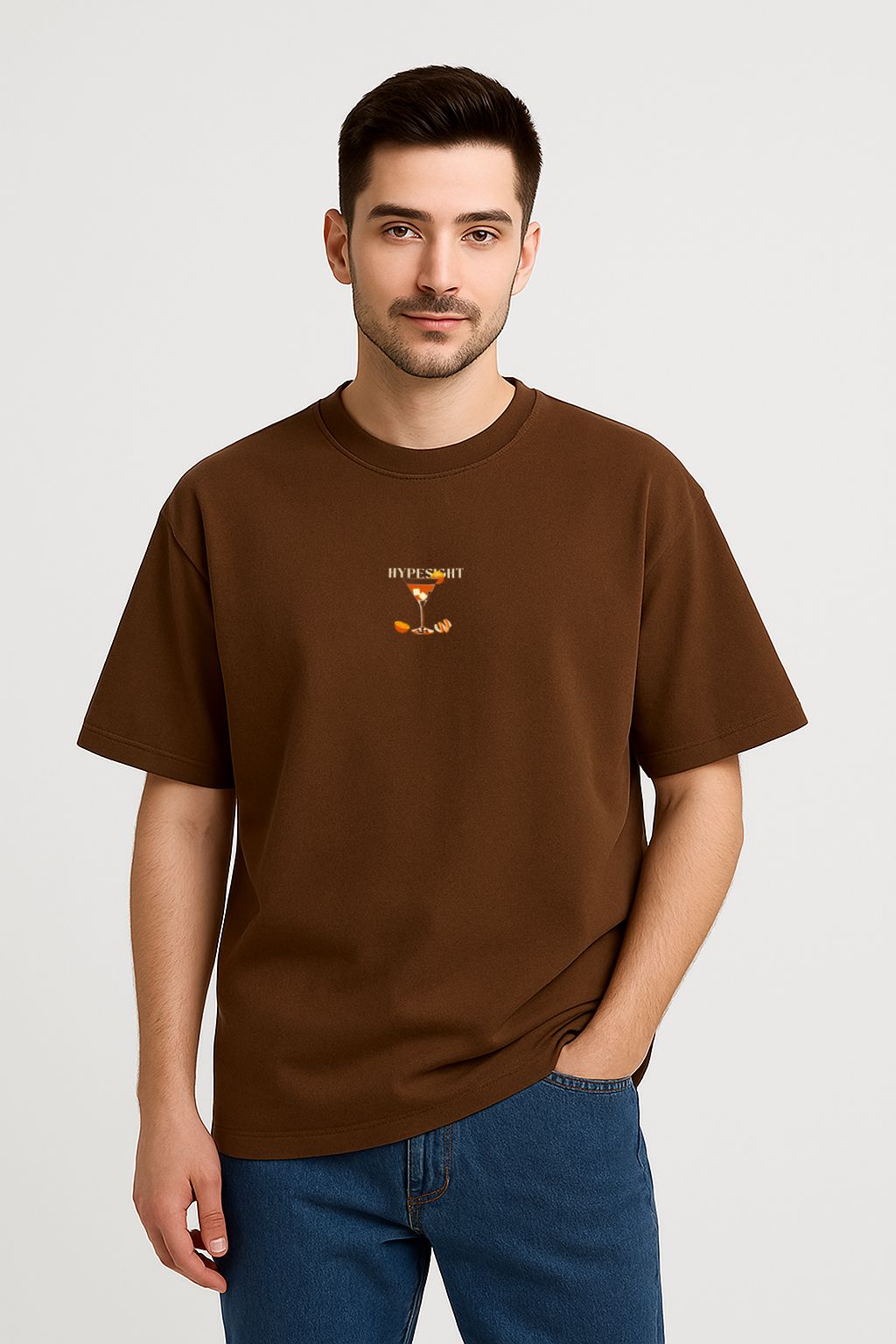 Front view of Brown Tequila Sunrise oversized cotton t-shirt with small cocktail glass graphic