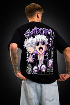 Person wearing a black t-shirt with a graphic design on the back against a dark background