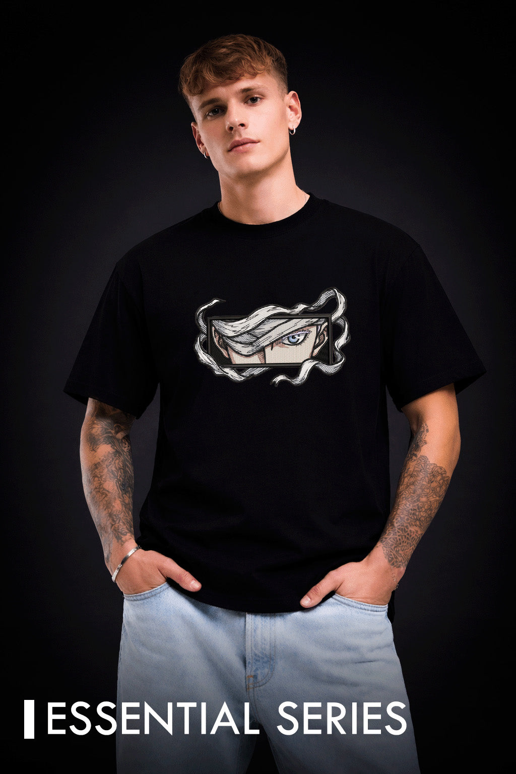 Person wearing a black t-shirt with a gojo front eye graphic design on a dark background