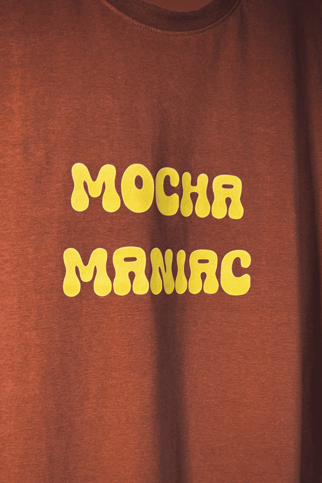 Brown t-shirt with yellow 'Mocha Maniac' text