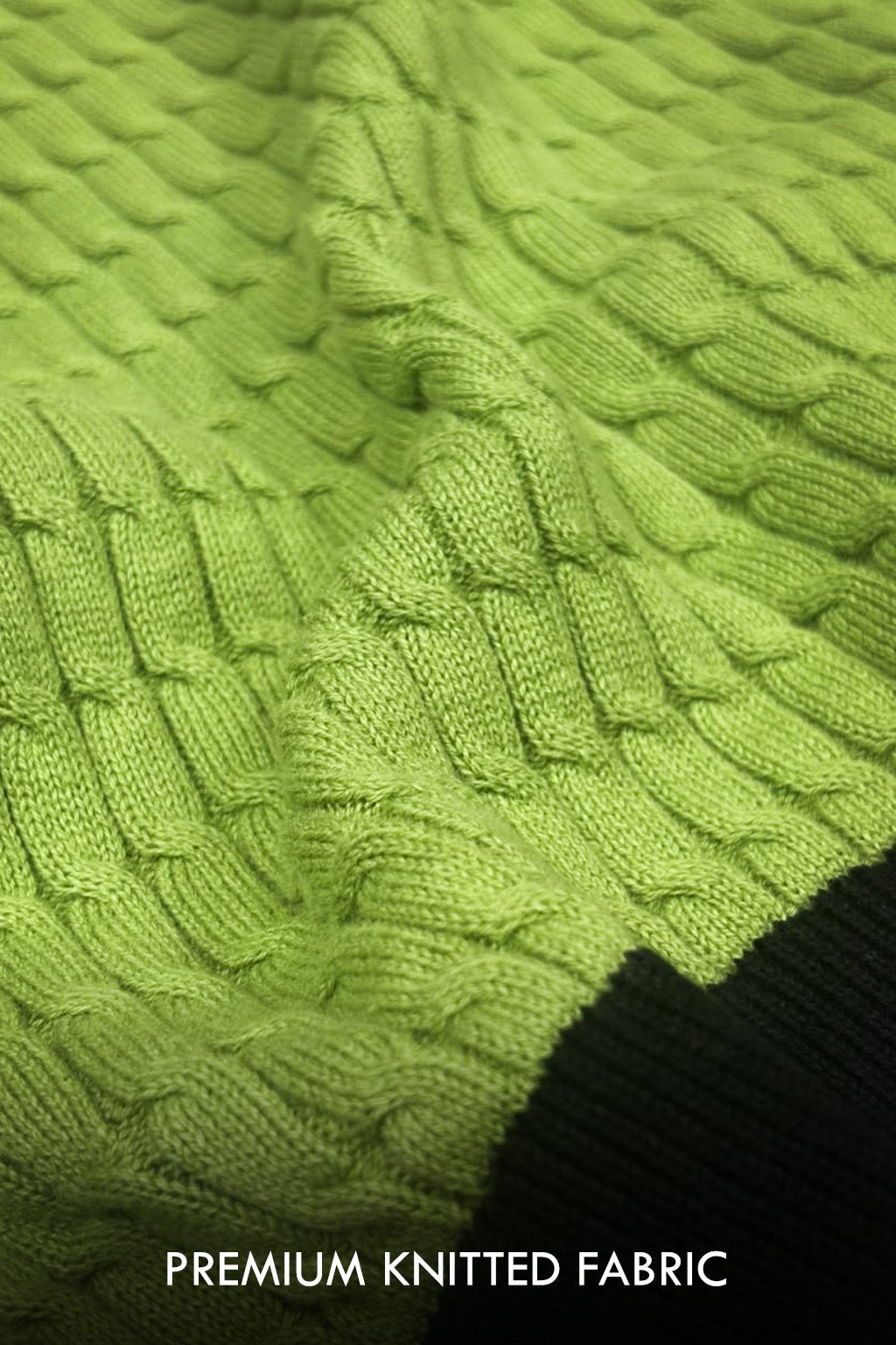 Close-up of a textured olive green knitted fabric with a cable pattern, showing the weave detail and a dark knit edge at the bottom right, with text reading 'PREMIUM KNITTED FABRIC' at the bottom.