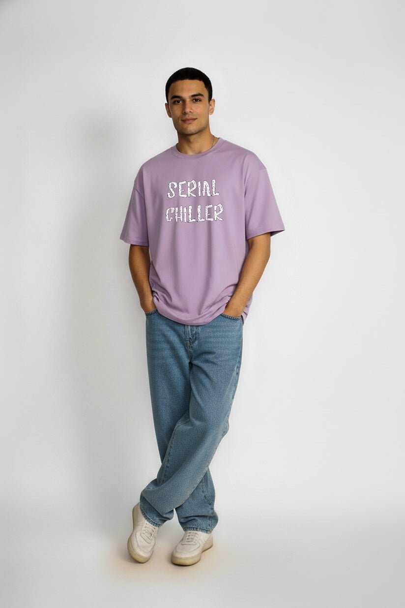 Full front view of Serial Chiller oversized lavender T-shirt styled with jeans and sneakers