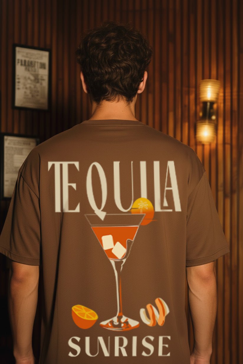 Back close-up view of Tequila Sunrise brown oversized T-shirt featuring cocktail glass and orange slice print