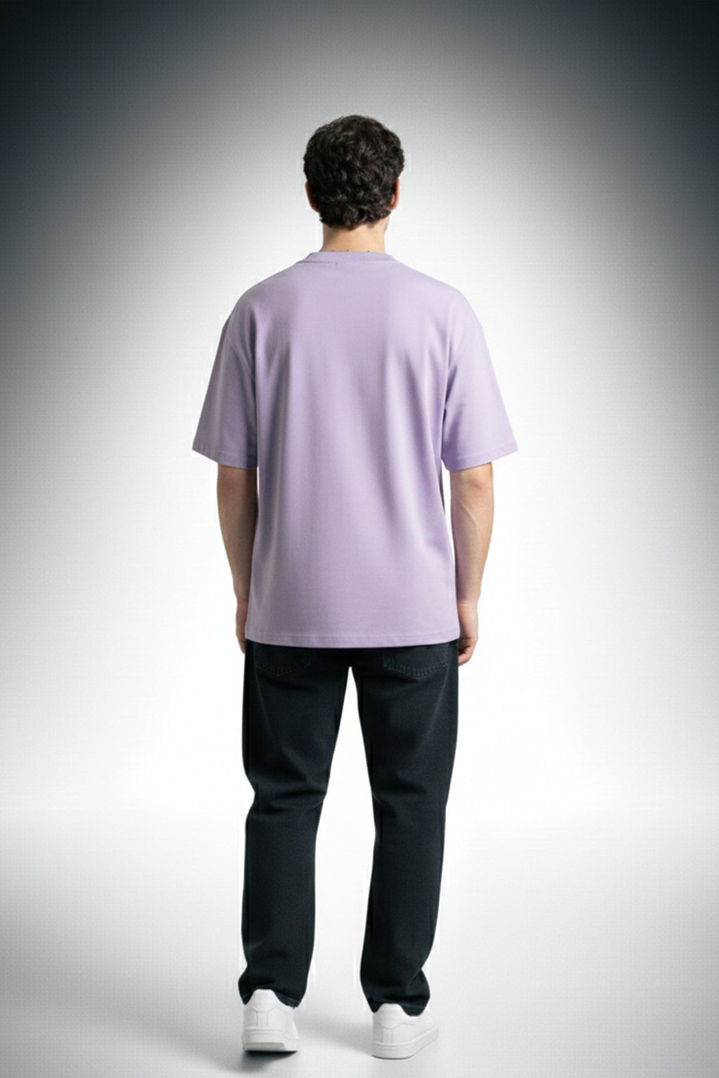 Back view of lavender oversized t-shirt for men and women showing relaxed fit and plain design made from soft cotton fabric