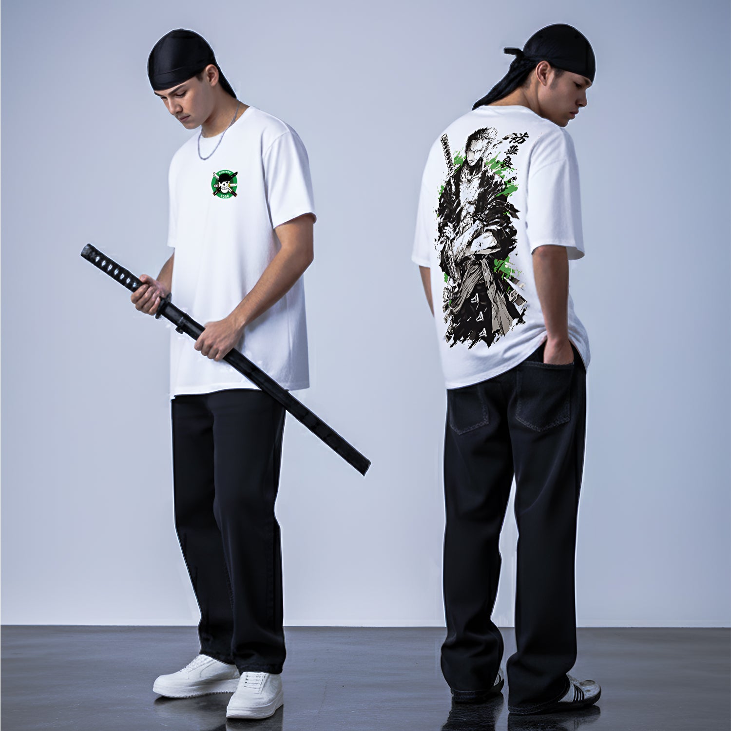 Person wearing a white t-shirt with a design on the back, holding a black sword against a plain background.